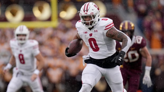 Wisconsin running back Braelon Allen (0) runs for a first down during the second quarter of their game Saturday, November 25, 2023 at Huntington Bank Stadium in Minneapolis, Minnesota. Wisconsin beat Minnesota 28-14.